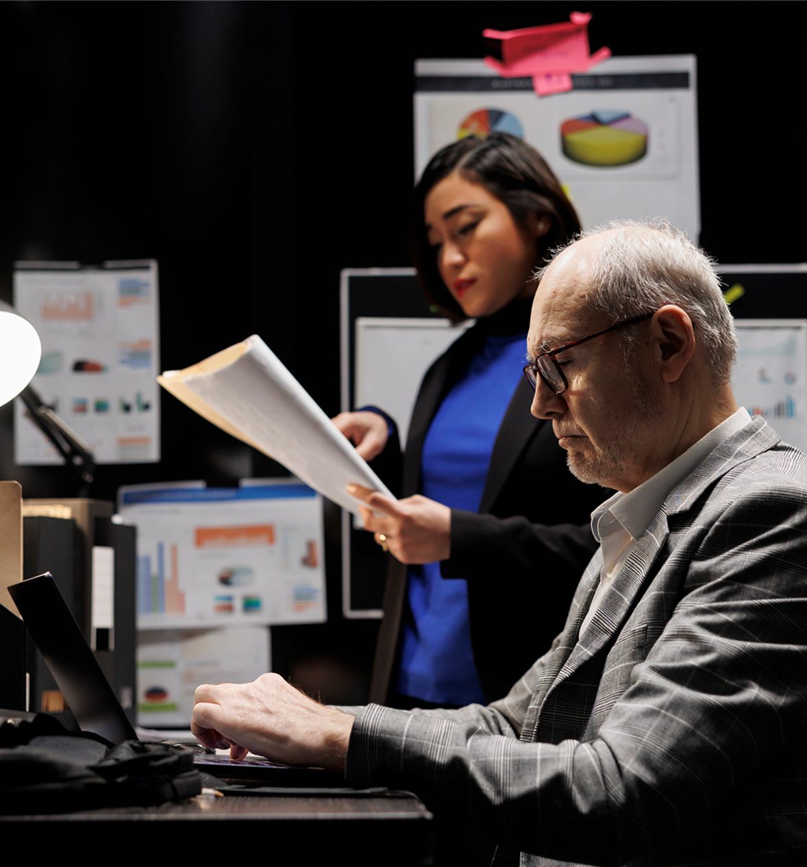 Business discussion with charts and papers