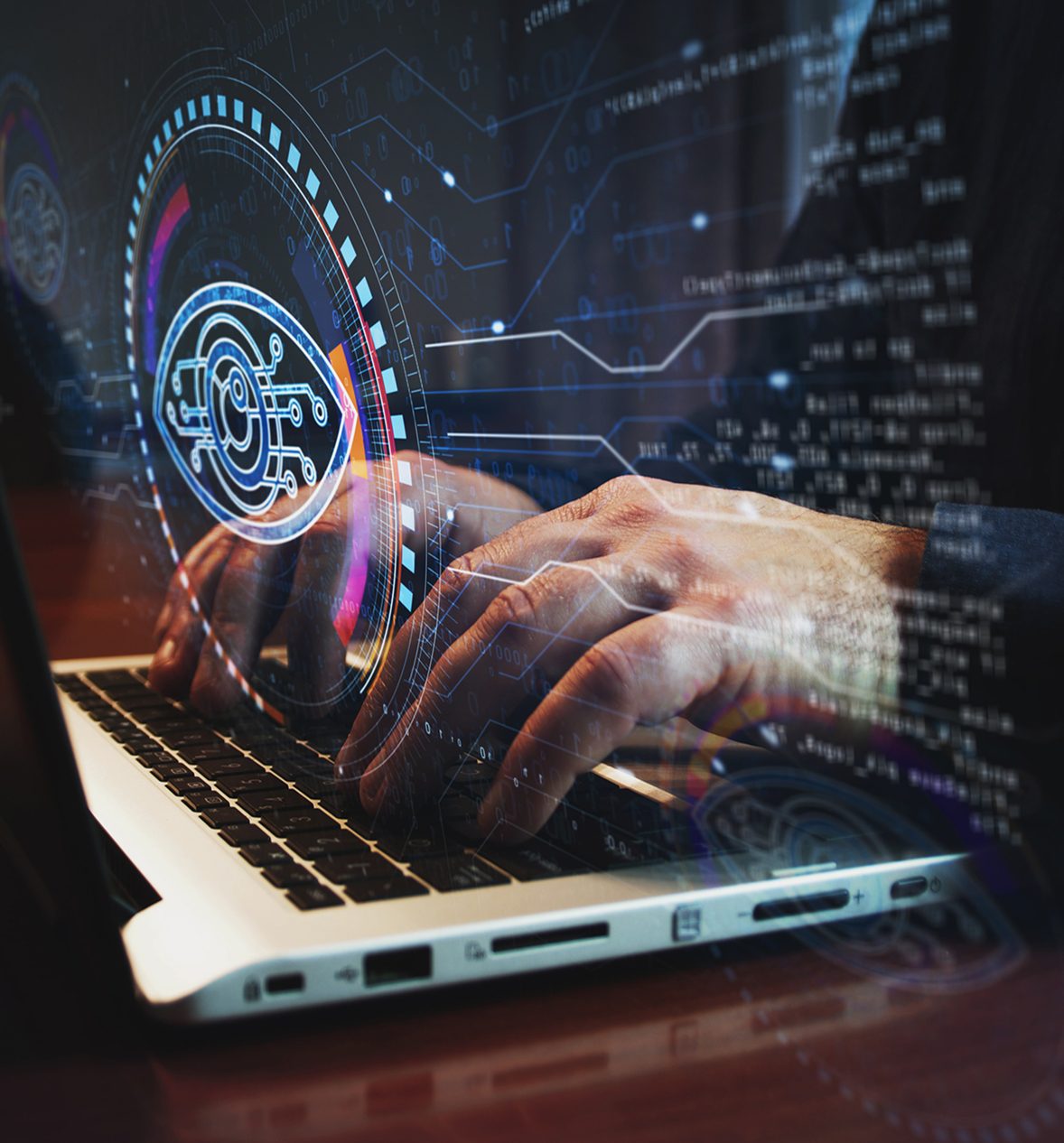 Hands typing on laptop with digital overlay