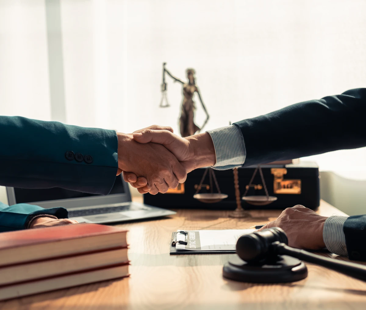Business handshake in a law office